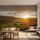 Modern interior featuring a large, seamless mountain sunset mural with warm colors and natural lighting effects.