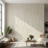 Sleek interior featuring a large, seamless wall mural with African geometric motifs, filling the space completely with beige and stripe accents.