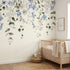 Interior scene of nursery corner featuring 'Forget Me Not' floral mural, showcasing texture and vibrant design in natural light.