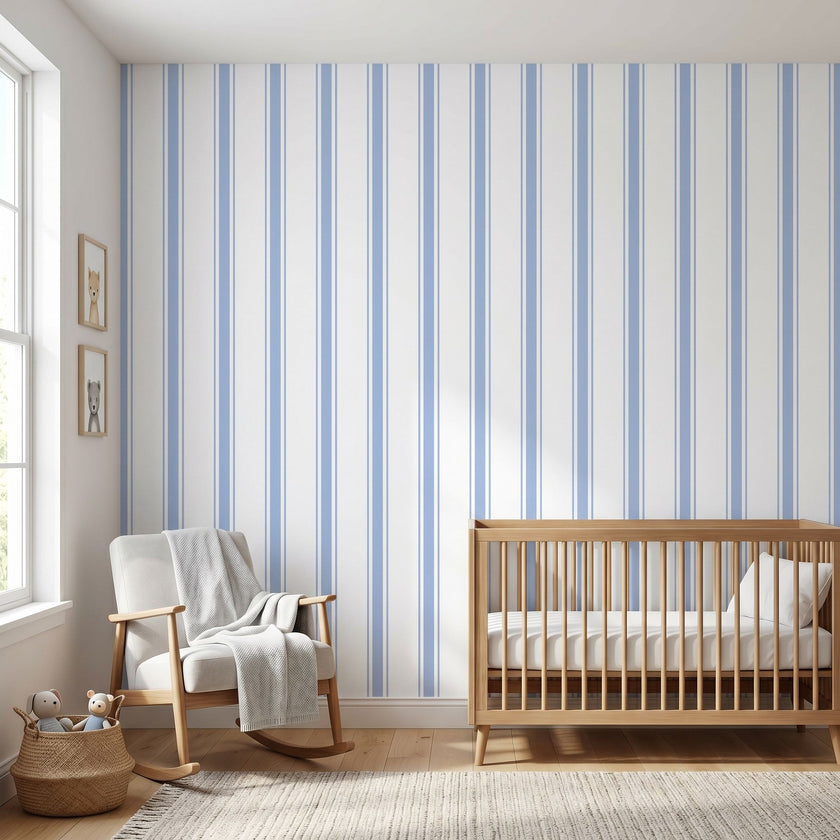 Realistic view of a nursery showcasing a large Baby Blue geometric mural on the wall in natural daylight.