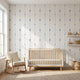 Seamless tulip mural on a large wall in a modern nursery or living room, illuminated by natural sunlight.