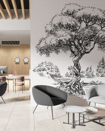 Black and white illustrated mural of a large tree beside a calm river in a peaceful countryside landscape. On a wall in an office seating room. 