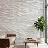 Detailed image of a wall mural with repeating geometric pattern in grey and white tones, installed in a contemporary office space.