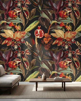Delicate wall mural featuring Persiphone floral pattern with orchids and pomegranates in black and red, covering a smooth, neutral-toned wall in a modern living room.