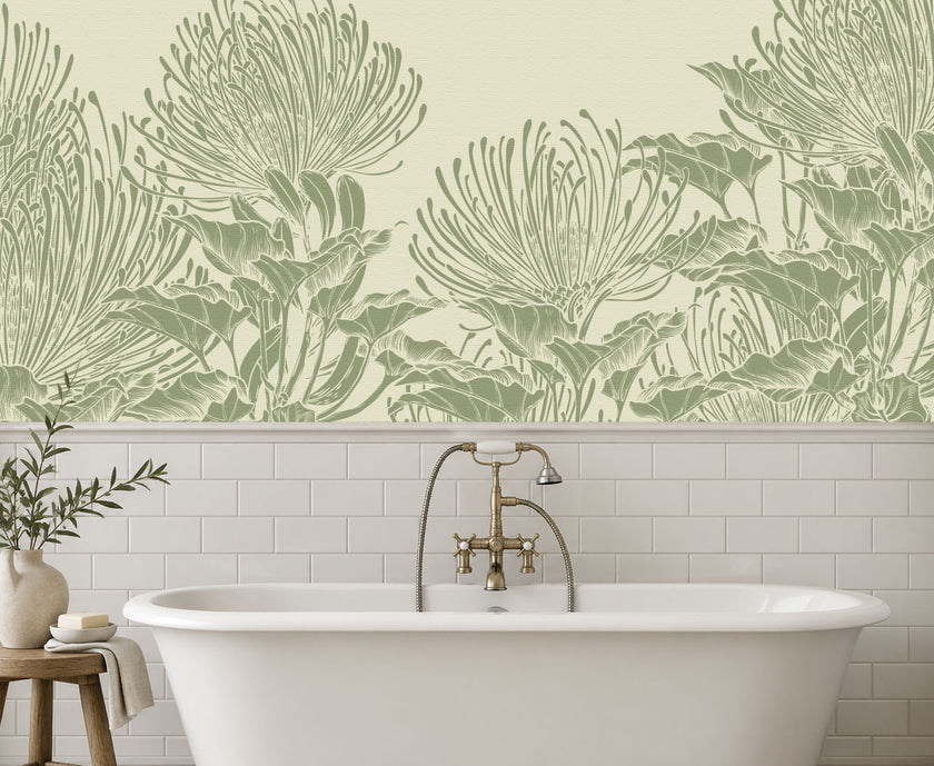 A bathroom scene featuring a white freestanding bathtub with a brass faucet, set against a wall with white subway tiles and a large botanical mural of hand drawn sage green pincushion proteas on a warm ivory background.