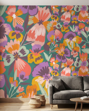 Vibrant wall mural of playful pansies filling a large wall in a modern interior with natural light.