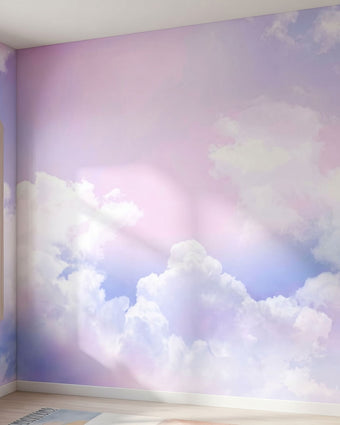 Vibrant sky mural with playful clouds in pinks, purples, and blues covering an entire wall with natural daylight streaming through a stylized window.