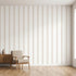 Studio-style wall mural with seamless beige stripe pattern filling the wall, evenly illuminated in a contemporary interior.