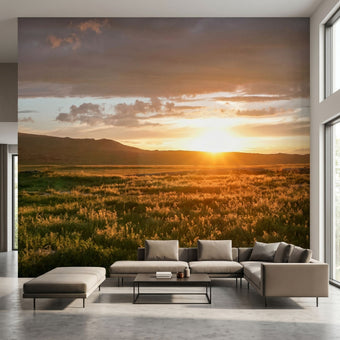 Interior scene with a wall-filling mountain sunset mural showcasing natural textures and vivid sunset hues.