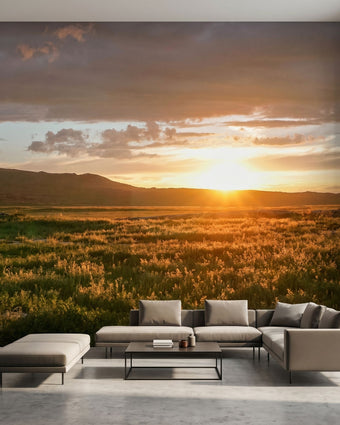 Interior scene with a wall-filling mountain sunset mural showcasing natural textures and vivid sunset hues.