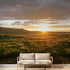 Interior with a seamless mountain sunset mural that fully covers the wall, highlighting detailed textures and vibrant colors.