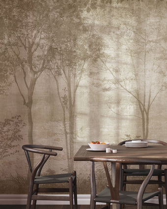 Sepia Foggy Forest mural featuring softly layered woodland trees and foliage in warm taupe and sepia tones, creating a misty, atmospheric forest scene with a vintage textured finish. On a wall in a dinning room with dark walnut wood furniture. 