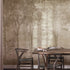 Sepia Foggy Forest mural featuring softly layered woodland trees and foliage in warm taupe and sepia tones, creating a misty, atmospheric forest scene with a vintage textured finish. On a wall in a dinning room with dark walnut wood furniture. 