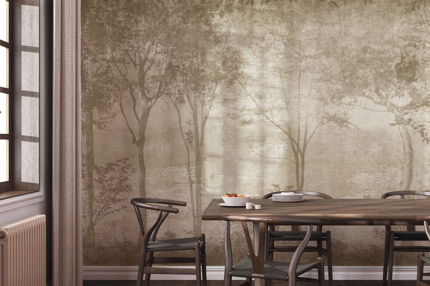 Sepia Foggy Forest mural featuring softly layered woodland trees and foliage in warm taupe and sepia tones, creating a misty, atmospheric forest scene with a vintage textured finish. On a wall in a dinning room with dark walnut wood furniture. 
