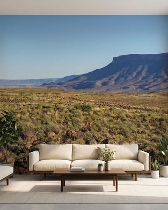 Seamless wall mural of a mountain landscape with lush greenery and clear blue sky, ideal for immersive home decor.