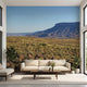 Seamless wall mural of a mountain landscape with lush greenery and clear blue sky, ideal for immersive home decor.