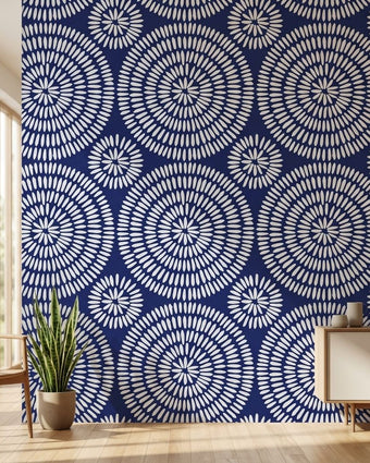 African-inspired Shweshwe Chic mural with seamless geometric pattern in navy and blue hues on a modern living room wall.