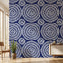 African-inspired Shweshwe Chic mural with seamless geometric pattern in navy and blue hues on a modern living room wall.