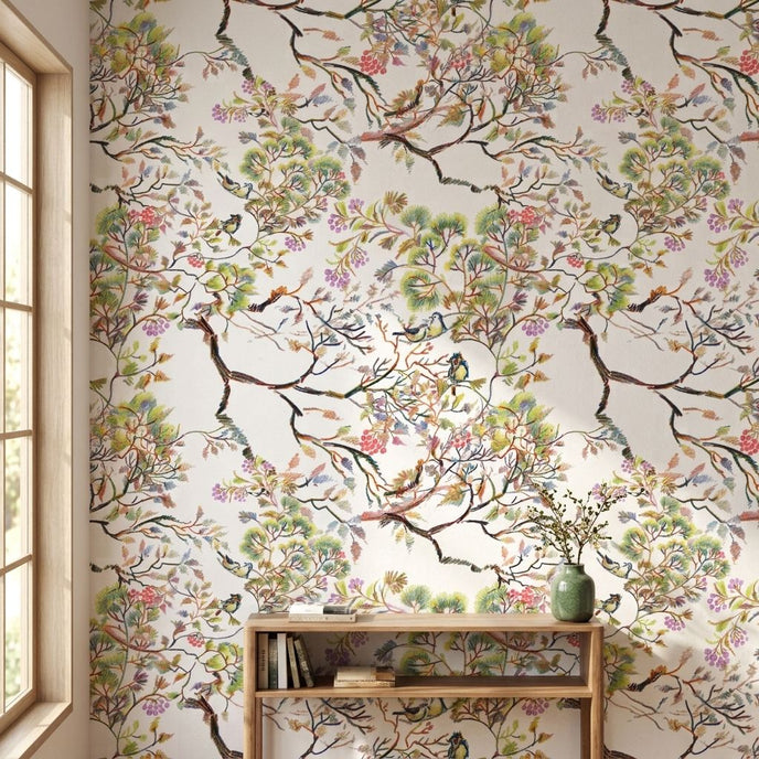 Close-up of 'Spring Renewal' mural featuring multicolored birds and floral patterns on textured living room wall, with natural light highlighting details.