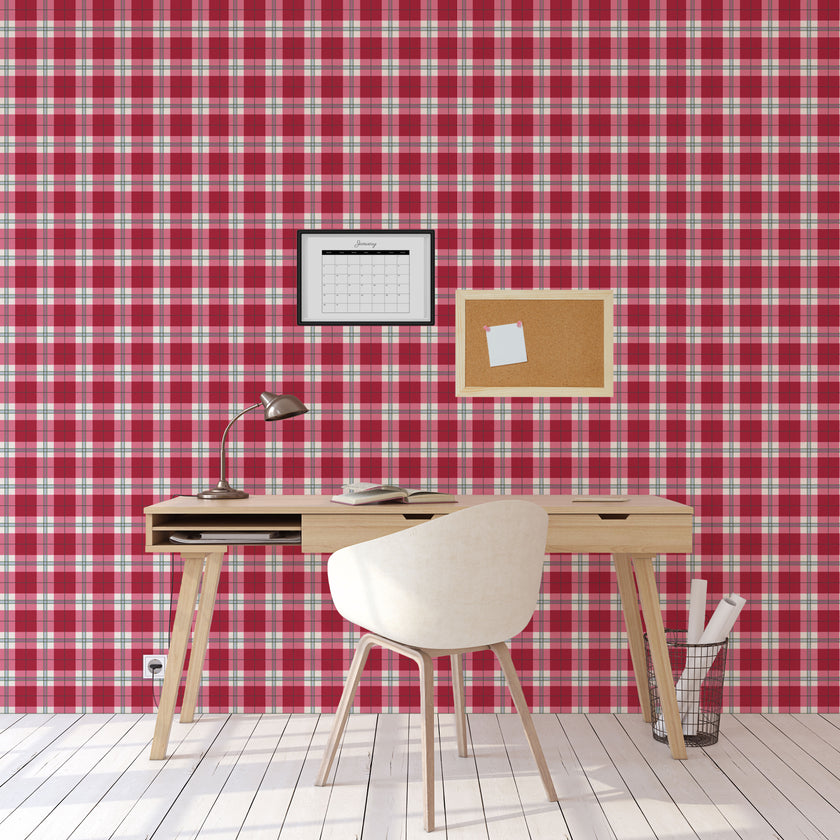 Playful pink tartan wallpaper with layered blush and red tones in a soft check design. On wall of study.