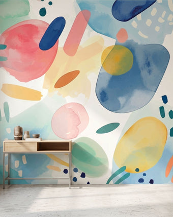 Stylish living space featuring a continuous multicoloured teal watercolour mural.