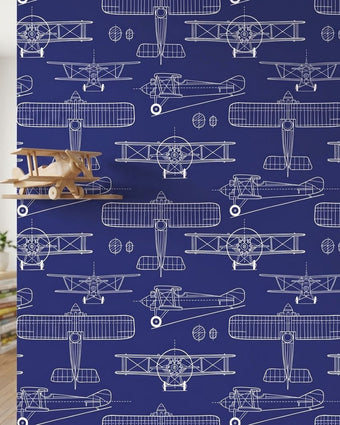 Close-up of the Taking Off - Blue mural with intricate seamless pattern in navy and blue, displayed on a matte wall with soft natural light.