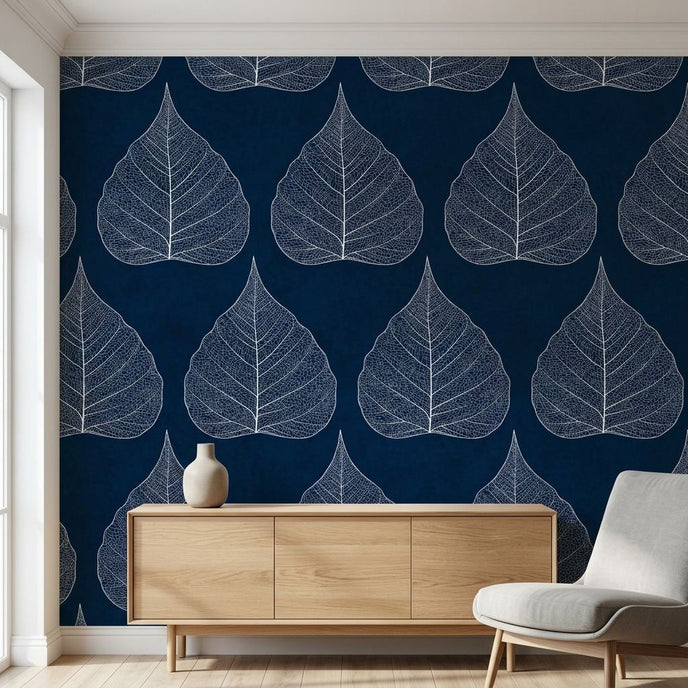 Close-up of the Traces floral mural on a wall showing blue leaves and seamless pattern in a modern living room setting.