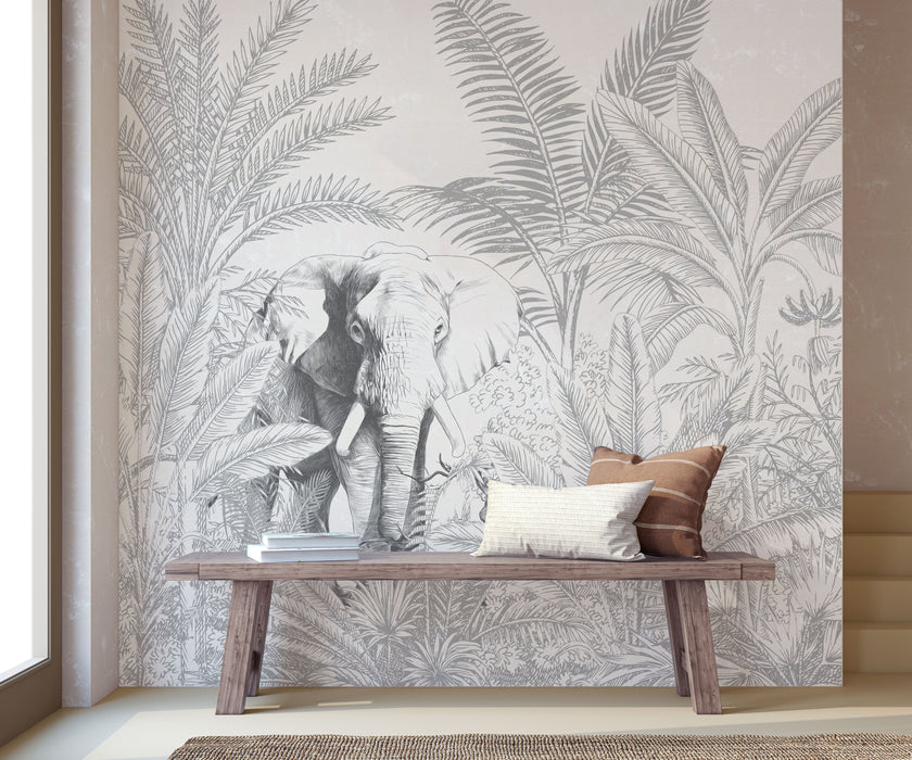 Hand-drawn tropical mural featuring an elephant surrounded by palm trees and dense botanical foliage in soft grey tones. Placed on a wall in a walkway, with a wooden bench in front on the mural.