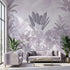 Vibrant tropical mural with purple flowers and lush greenery covering the entire wall in natural outdoor lighting.