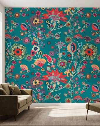 Large vibrant floral mural in turquoise and multicolored tones, filling a white wall in a modern living room with intricate details and natural light.