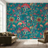 Large vibrant floral mural in turquoise and multicolored tones, filling a white wall in a modern living room with intricate details and natural light.