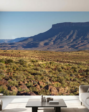 Full-wall mural featuring vibrant mountains, hills, and a tranquil lake, designed to cover entire wall space with natural lighting.