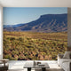 Full-wall mural featuring vibrant mountains, hills, and a tranquil lake, designed to cover entire wall space with natural lighting.