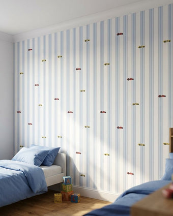 Vivid mural in a young boy's bedroom with blue, white, yellow, and red striped wallpaper featuring cars.