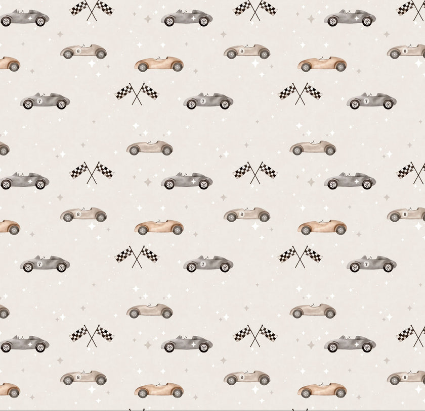 Vintage racing car wallpaper featuring classic race cars, checkered flags, and scattered stars in soft neutral colours, ideal for nurseries, kids' bedrooms, and playrooms.
