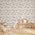 Vintage racing car wallpaper featuring classic race cars, checkered flags, and scattered stars in soft neutral colours, ideal for nurseries, kids' bedrooms, and playrooms.