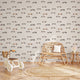 Vintage racing car wallpaper featuring classic race cars, checkered flags, and scattered stars in soft neutral colours, ideal for nurseries, kids' bedrooms, and playrooms.