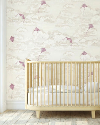 Close-up of 'Where's My Kite?' pink mural with colorful kites in a bright nursery setting, wall-mounted and fully covering the wall.