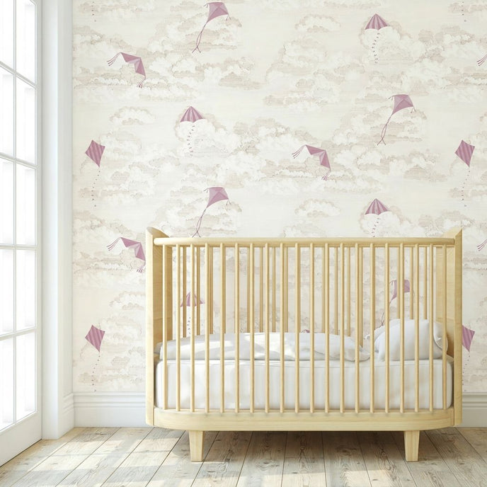 Close-up of 'Where's My Kite?' pink mural with colorful kites in a bright nursery setting, wall-mounted and fully covering the wall.
