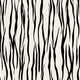 Vertical zebra stripe wallpaper with a seamless repeat, featuring flowing black stripes on a white background in a bold animal inspired pattern.